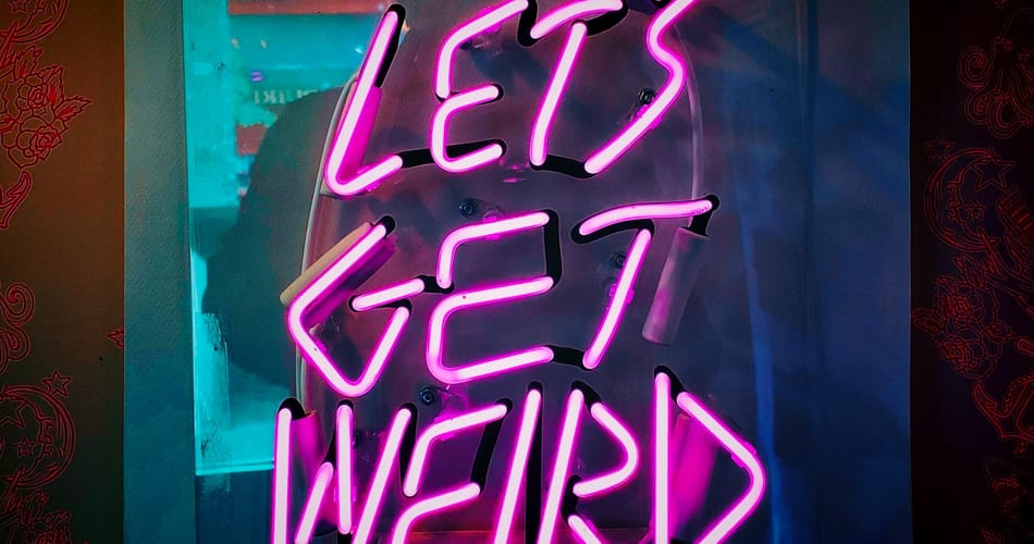 Pink neon sign reading "LET'S GET WEIRD" against a blue and purple gradient background